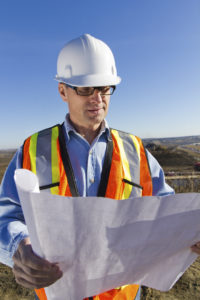 Construction Engineer looking at blueprints