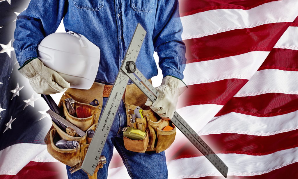 Contractor standing in front of USA flag
