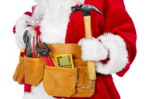 Contractor dressed as Santa with a tool belt