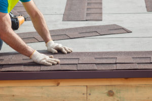 Roofing Contractor installing shingles