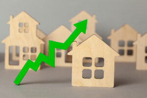 Arrow pointing up for increased value of a house