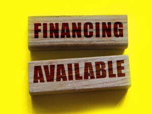 Financing available words on wooden blocks