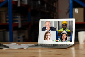 Warehouse staff on a video call in storage warehouse