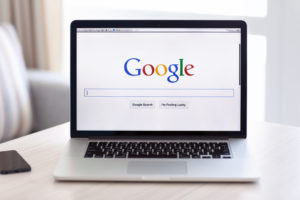 Computer with Google home page on the screen