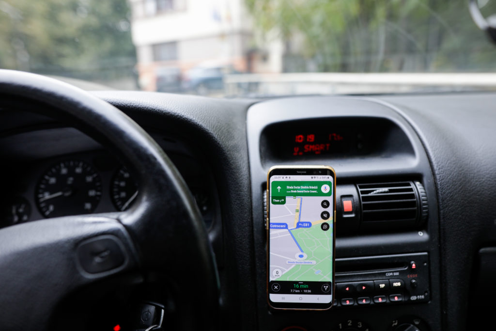 Google maps on a phone in a car giving directions
