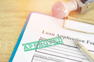 Loan application marked with approved