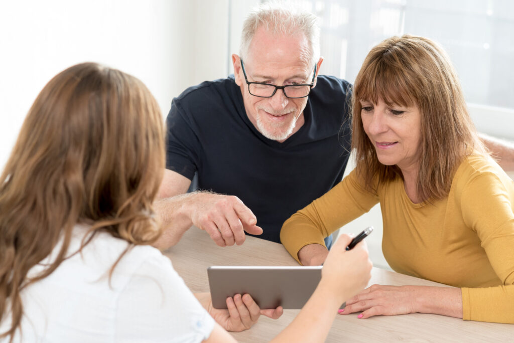 homeowners looking at tablet together