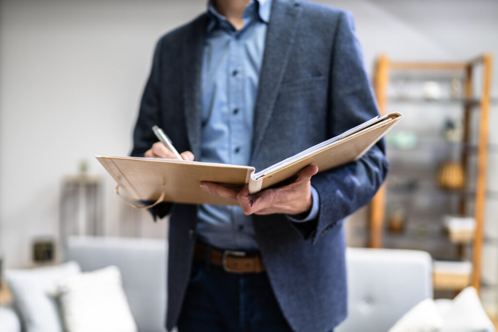 man in suit completes project estimate house appraisal