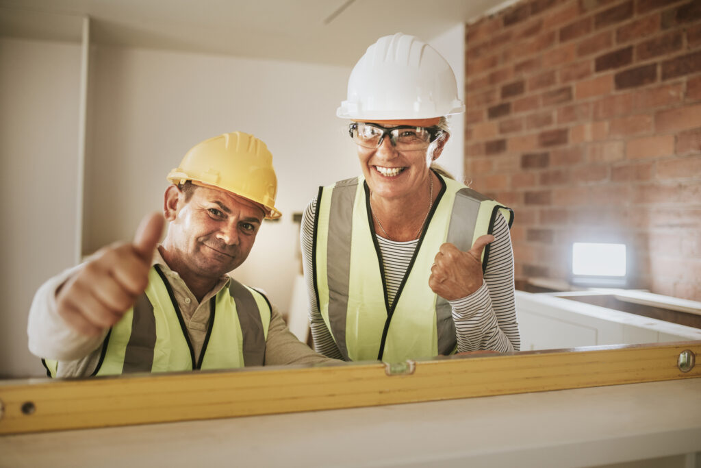 thumbs up by contractor coworkers at a construction site